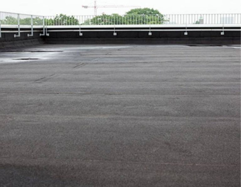 Flat commercial rooftop with built-up roofing system, designed for enhanced durability, weather resistance, and long-term waterproof protection.