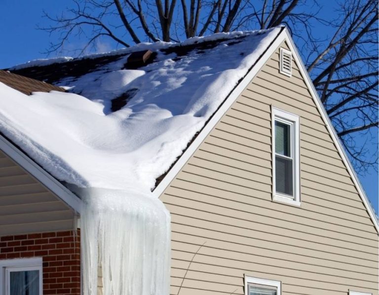 Ice dam and snow buildup on the roof of a Maryland home in winter